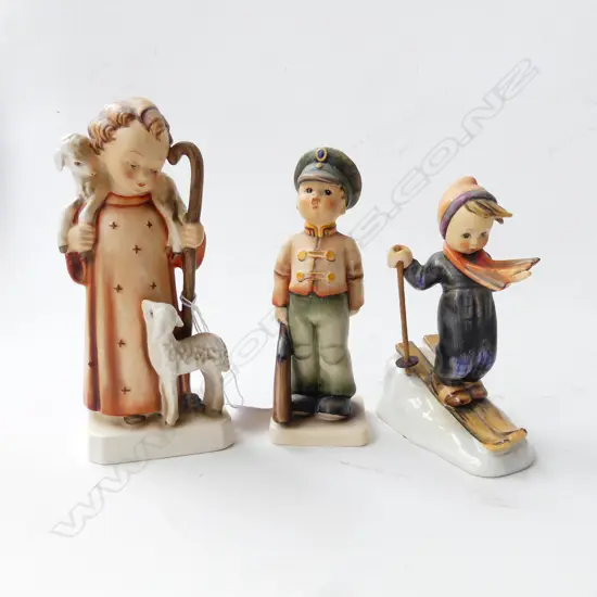 3 HUMMEL FIGURINES; CHILDw. SKIS, BOY in UNIFORM, GIRL SHEPHERD 160mm