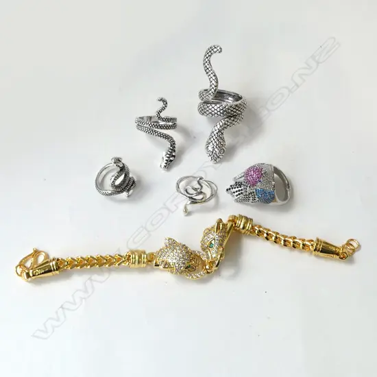 COSTUME ITEMS; DIAMANTE BRACELET, 4 SNAKE RINGS & BIRD RING