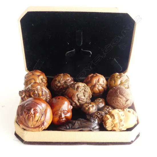 COLLECTION OF 12 WOOD CARVED NETSUKE