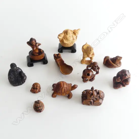 COLLECTION OF 12 CARVED WOOD NETSUKE