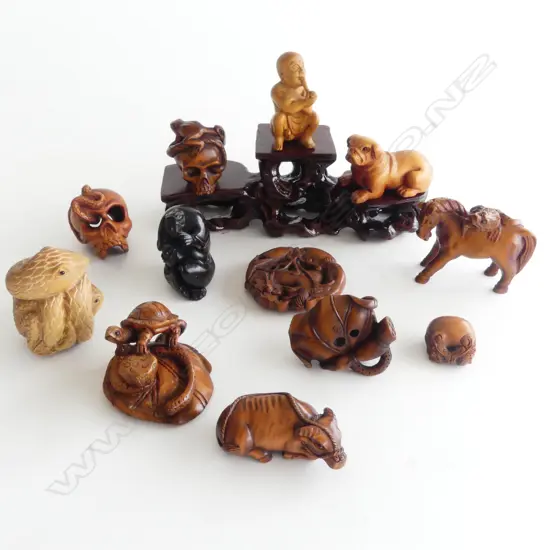 COLLECTION OF 12 WOOD NETSUKE & STAND