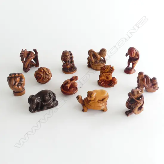 COLLECTION OF 12 WOOD NETSUKE