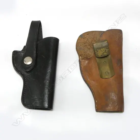 2 OLD LEATHER PISTOL HOLSTERS: 1 black with chrome dome. 1 brown with brass hook belt fitting
