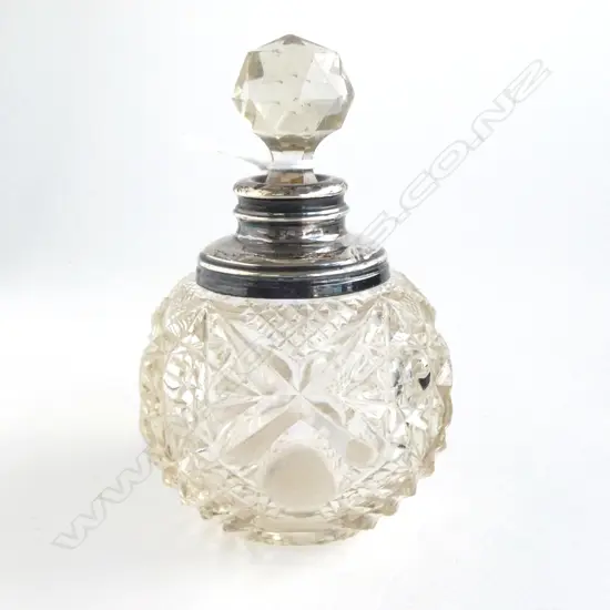 EDWARDIAN FANCY SILVER TOPPED CUT CRYSTAL PERFUME BOTTLE. H.115mm