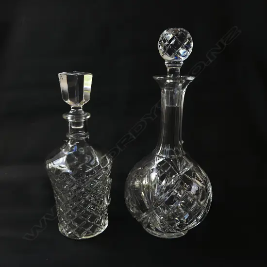 2 DECANTERS - 1 GLASS WITH DAMAGED STOPPER & 1 CRYSTAL H.300mm