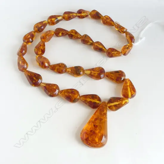 PROCESSED AMBER NECKLACE graduated with lge pendant SUN SPANGLE INCLUSIONS. L.660mm