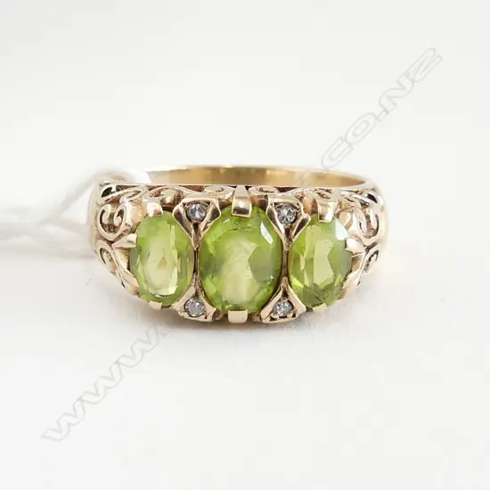 9CT Y/GOLD 3 STONE PERIDOT & DIAMOND DRESS RING 4.9grms SIZE O ( 1 stone has a chip & stones showing wear)