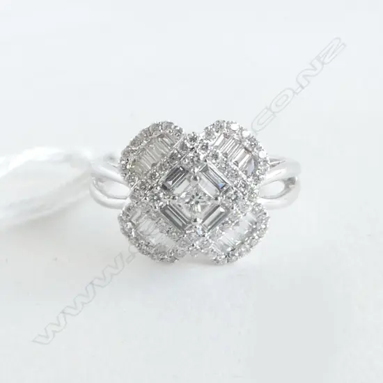 18ct WHITE GOLD & DIAMOND CLUSTER RING TDW. 0.75ct RETAIL $3700. Quatrefoil design. Baguette & brilliant cuts