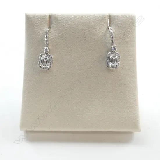 PR 18ct WHITE GOLD & DIAMOND EARIINGS ea with a 0.32ct emerald cut diamond surrounded by diamonds TDW. 0.93ct 