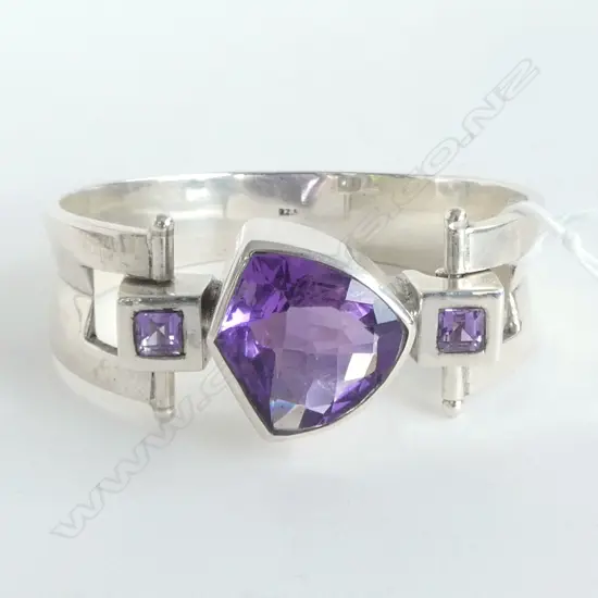 STERLING SILVER AND AMETHYST BANGLE inside diameter 6cm across x 4.5 depth