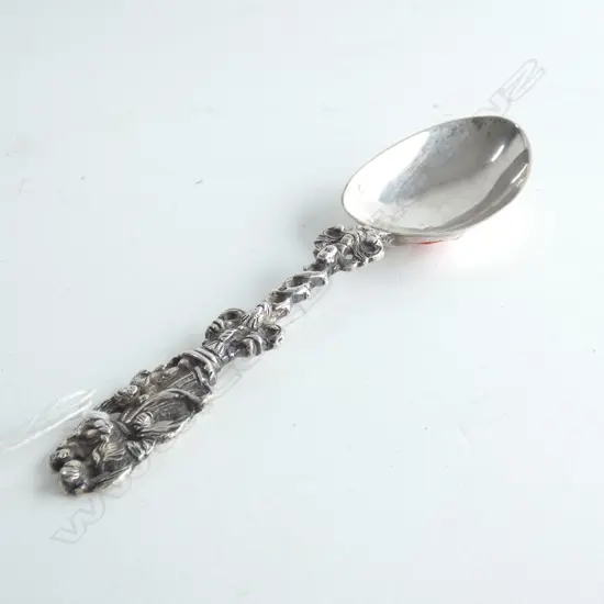 19thC Dutch silver birth spoon the finial as a mother with two children the entwined stem with stylised scroll and mas