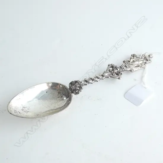 19thC Dutch silver birth spoon w finial as a mother with two children. Prick engraving to back of bowl. Hallmarked 1862