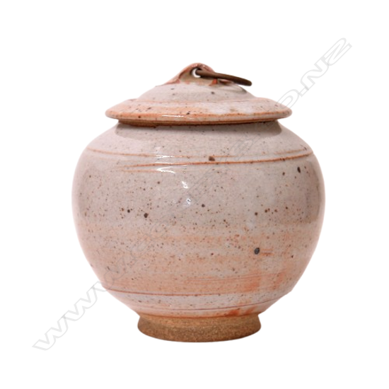 Campbell Hegan lidded shino glazed jar lid with brass ring captured to the lug. Potter's name to base H.145mm