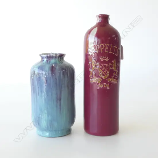 2 PCS CROWN LYNN; AMBRICO CYLINDER VASE, BLUE & PURPLE GLAZE, H.190mm (chip to foot) & SEPPELTS BURGUNDY BOTTLE H.270mm