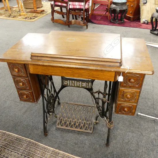 OLD TREADLE SINGER SEWING MACHINE with extras & booklet