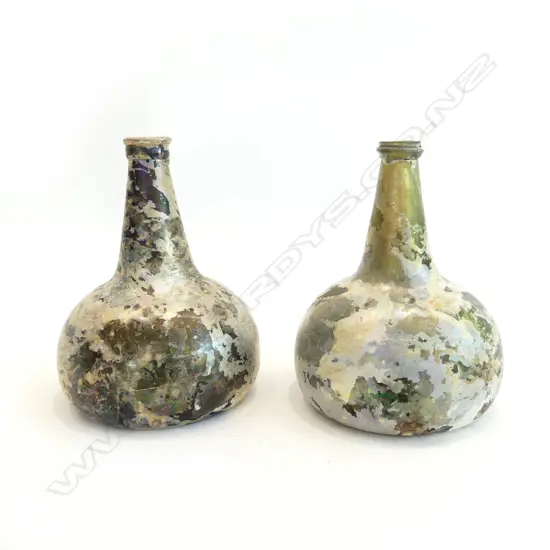 A pair of Dutch or English 17thC onion wine bottles with rich iridescent patina.