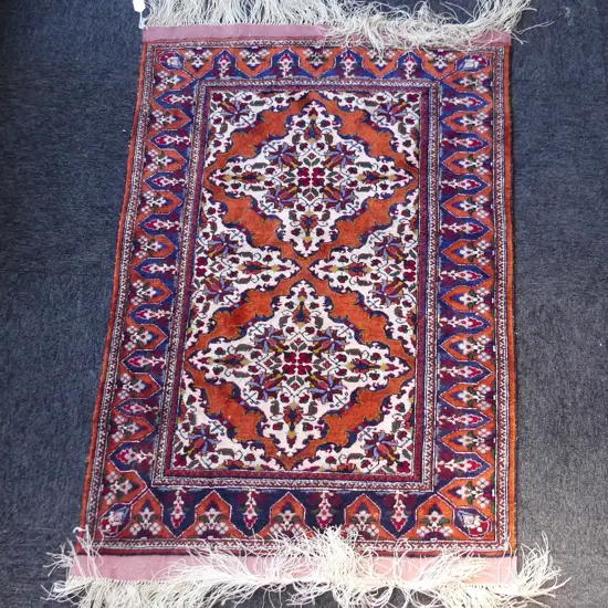 An Afghan raw silk small rug