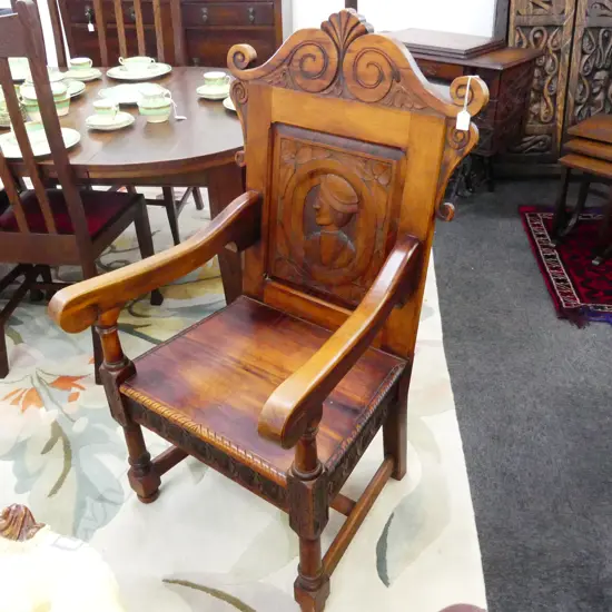 LG CARVED WOODEN ARMCHAIR
