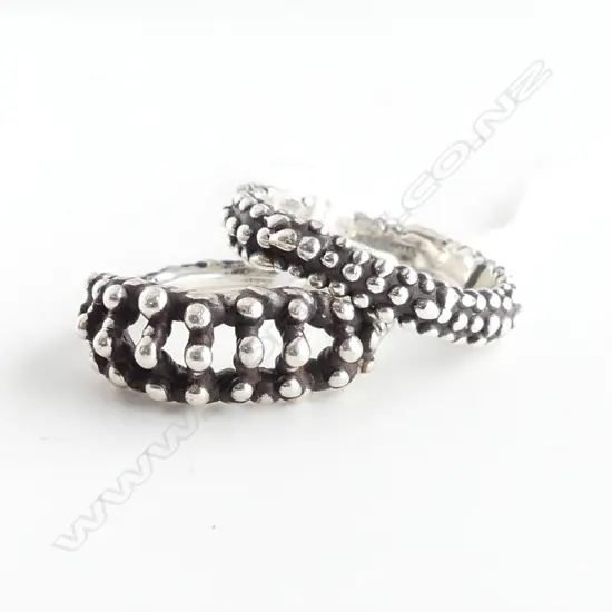 TWO DESIGNER SILVER RINGS SIZE K