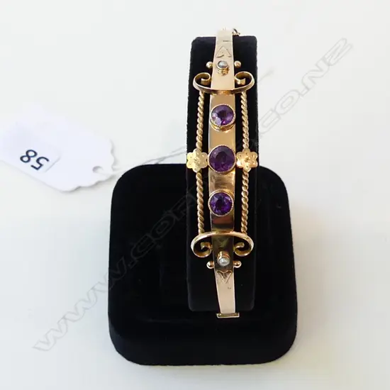 9ct AMETHYST SET BANGLE HALLMARKED 'CHESTER', 6.1gm (faults)