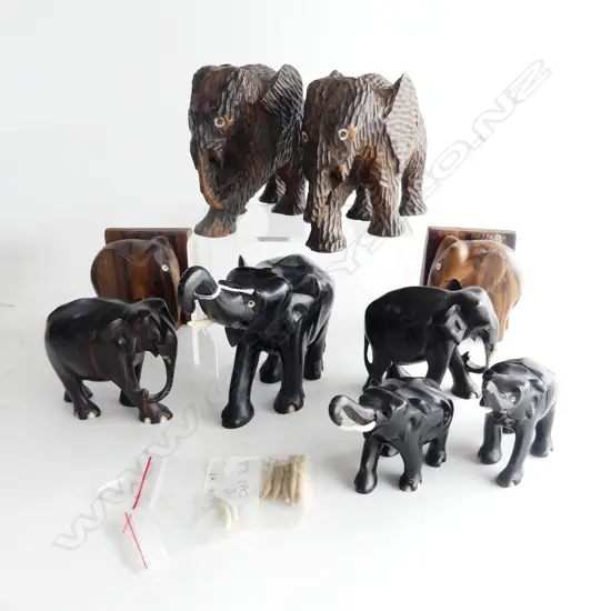 GROUP OF NINE CARVED ELEPHANTS. TWO CHIP CARVED H.140mm FIVE EBONY &TWO ZEBRAWOOD BOOKENDS