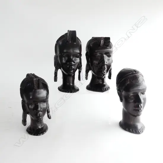 FOUR EBONY AFRICAN BUSTS. THREE FEMALE (WITH EARRINGS) ONE MALE. ALL H.200mm 