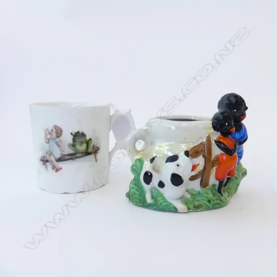  TWO ANTIQUE CHILDREN’S MUGS – BOY WITH FROG, AND BLACK CHILDREN WITH DOG