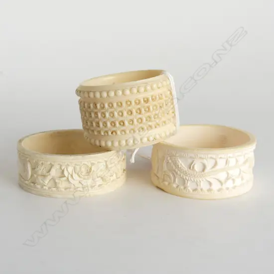 THREE IVORY CARVED NAPKIN RINGS DRAGON ETC D.50MM