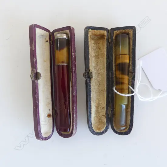 TWO DECO PERIOD CIGARETTE HOLDERS IN ORIGINAL CASES