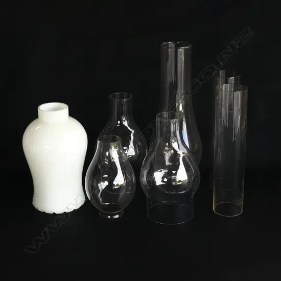 SEVEN ASST. VINTAGE GLASS CHIMNEYS FOR KEROSENE LAMPS H.17CM-25CM