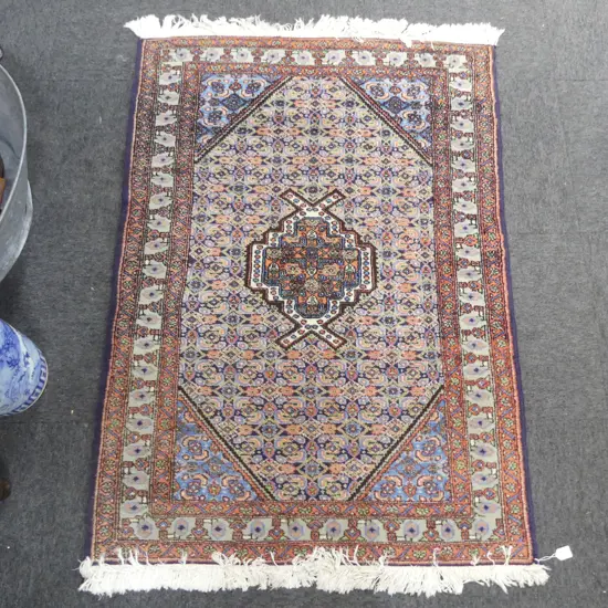 HAND KNOTTED WOOL PILE RUG