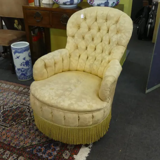 EDWARDIAN YELLOW UPHOLSTERED BUTTON BACK ARMCHAIR