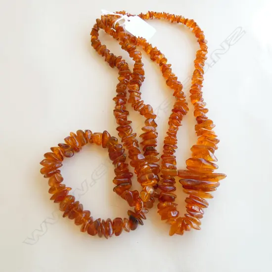 TWO LONG AMBER CHIP NECKLACE L.600mm ea approx