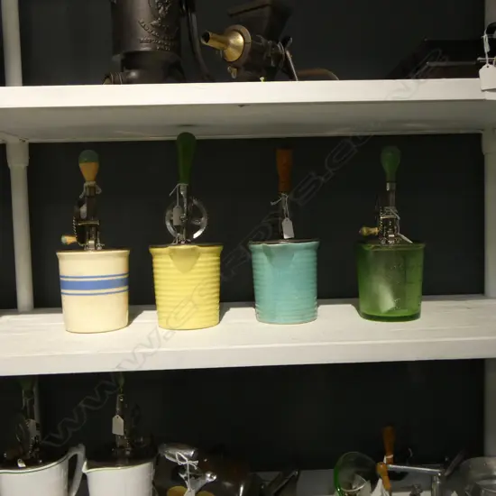 (3185/2848/3169) 3 VINTAGE HAND HELD ROATARY BEATERS; 3 ON CERAMIC MEASURES & 1 GREEN GLASS H.310mm