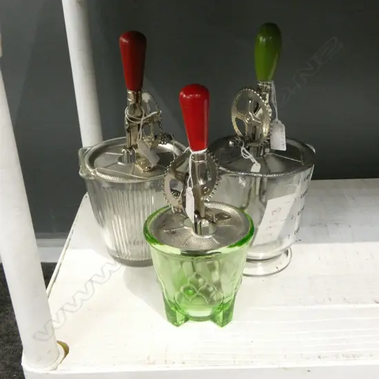 (2953/3053/2406) 3 VINTAGE HAND HELD ROTARY BEATERS ON GLASS MEASURES H.300mm