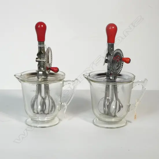 (1535/2152) 2 VINTAGE HAND HELD MERRY WHIRLS ON CLEAR GLASS 'HANDMAID' MEASURE JUGS 