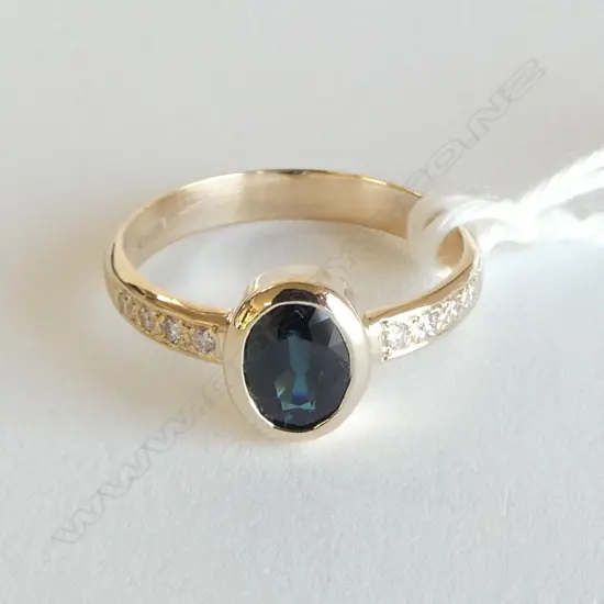 9ct Y/G DIAMOND & SAPPHIRE DRESS RING sapphire 1.02ct. 8x Diamonds TDW 0.10ct. 2.71gms. Size P