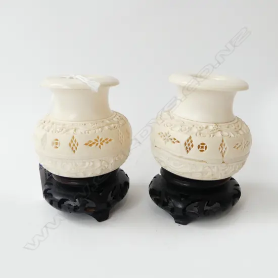 PR CHINESE CARVED IVORY VASES H.68mm on carved wood stands. Some faults
