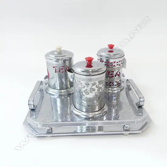 TWO SILVER METAL TEA CADDIES + JUG H.130mm ON METAL TRAY