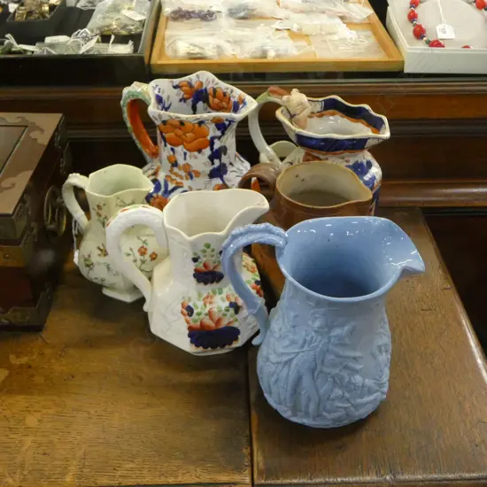 6 ANTIQUE JUGS; MASON TYPE IRONSTONE ETC H.190mm