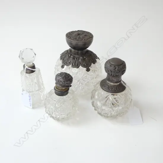 4 EARLY 20thC EMBOSSED STG SILVER TOPPED SCENT BOTTLES H.130mm (1 NEEDS REPAIR)