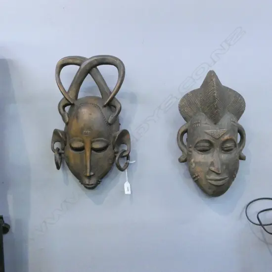   TWO CARVED AFRICAN MASKS Aprox. H380mm