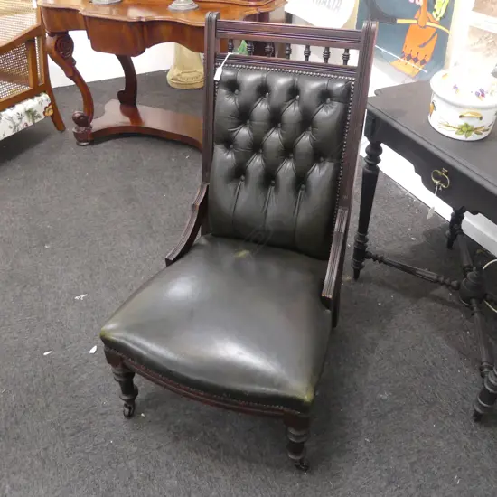 EDWARDIAN KAURI COLONIAL NURSING CHAIR IN GREEN LEATHER..