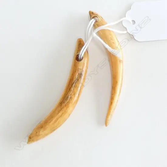 2 TUSKS; HAND CUT SUSPENSION HOLES L.67mm