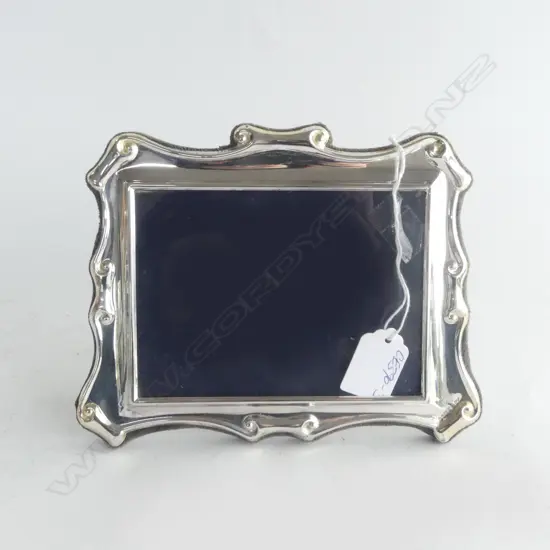 SILVER PHOTO FRAME with scroll detail. Landscape format. Blue velvet backing 150 x 195mm
