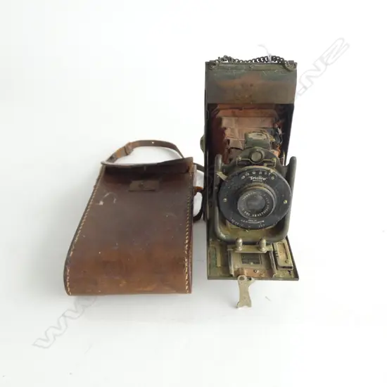 VINTAGE 'ENSIGN CARBINE TROPICAL MODEL' FOLDING CAMERA. metal finish. Red bellows. Showing some age. In leather case