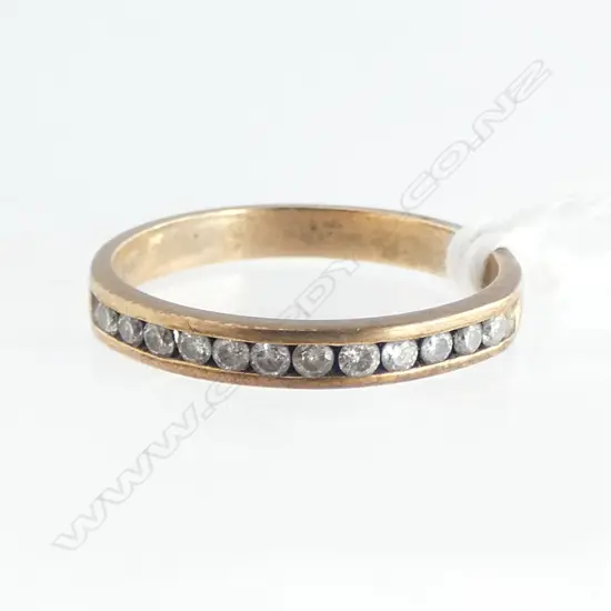9ct Y/GOLD 12 small DIAMOND RING channel set. 1.65gms SIZE N