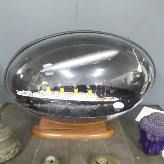 LG MODEL; SINKING TITANIC + HINDENBURG IN EGG SHAPED DISPLAY CASE 1000x550x700mm