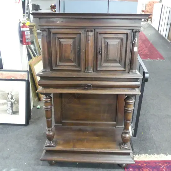 19thC CONTINENTAL WALNUT CABINET ON STAND 2 panelled cupboards above open base w lower shelf. Turned columns. H.1535mm