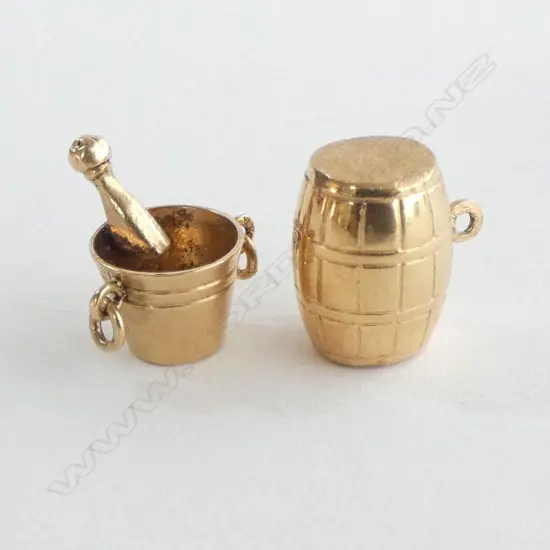 2 18CT CHARMS; BARREL, CHAMPAGNE COLLER AND BOTTLE TOP[ 3.2grms